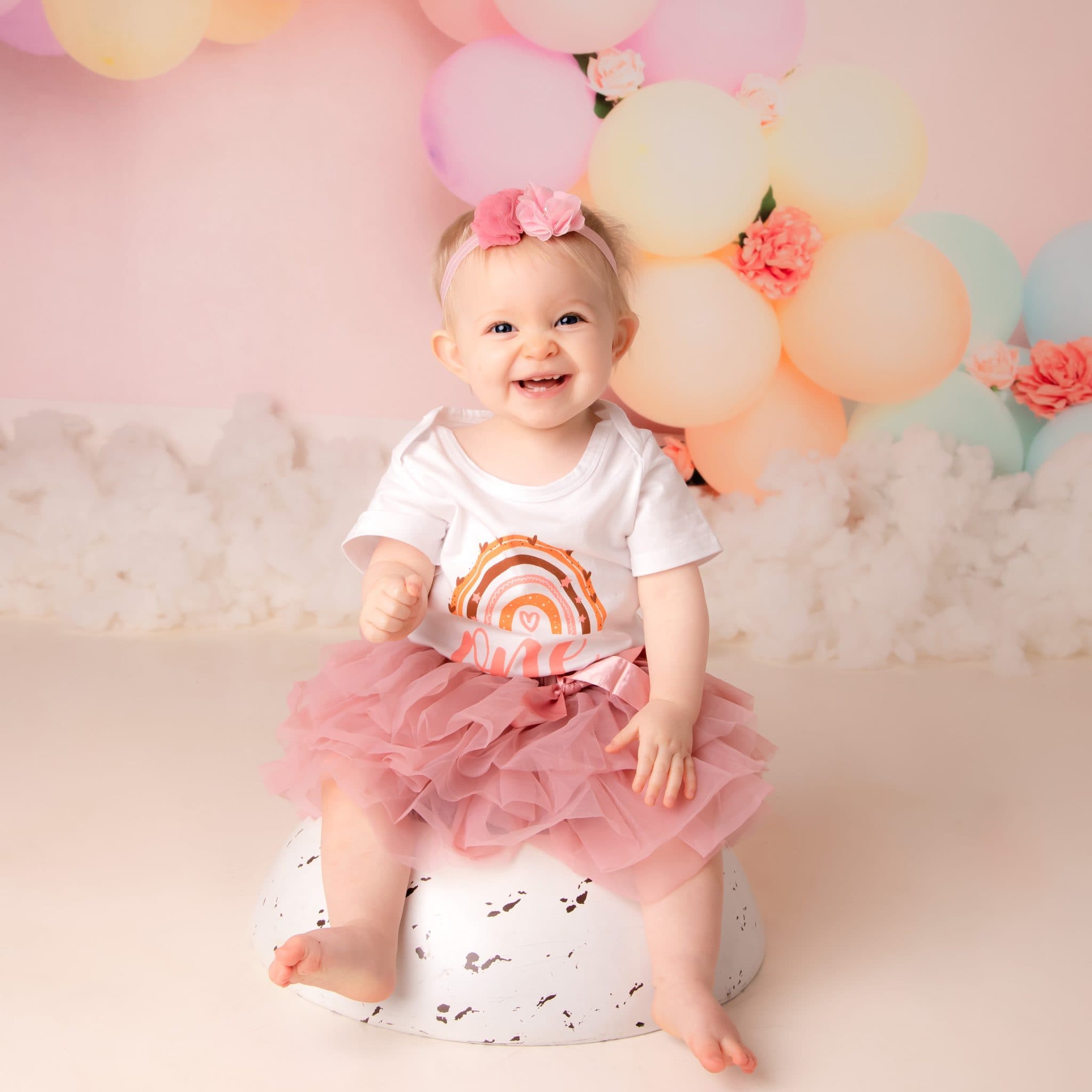Child enjoying a styled studio portrait session