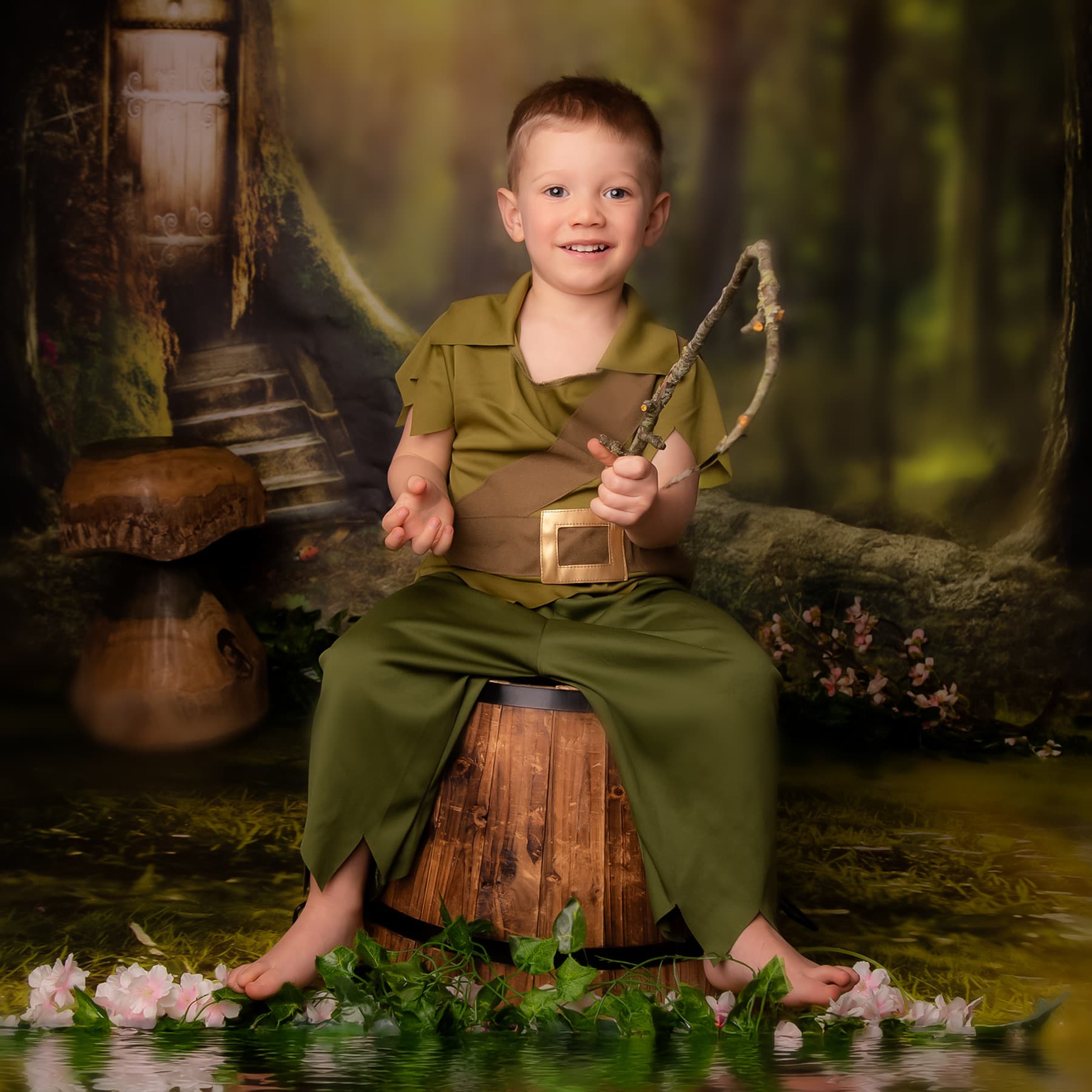 Child in a fairy dress with woodland styling.