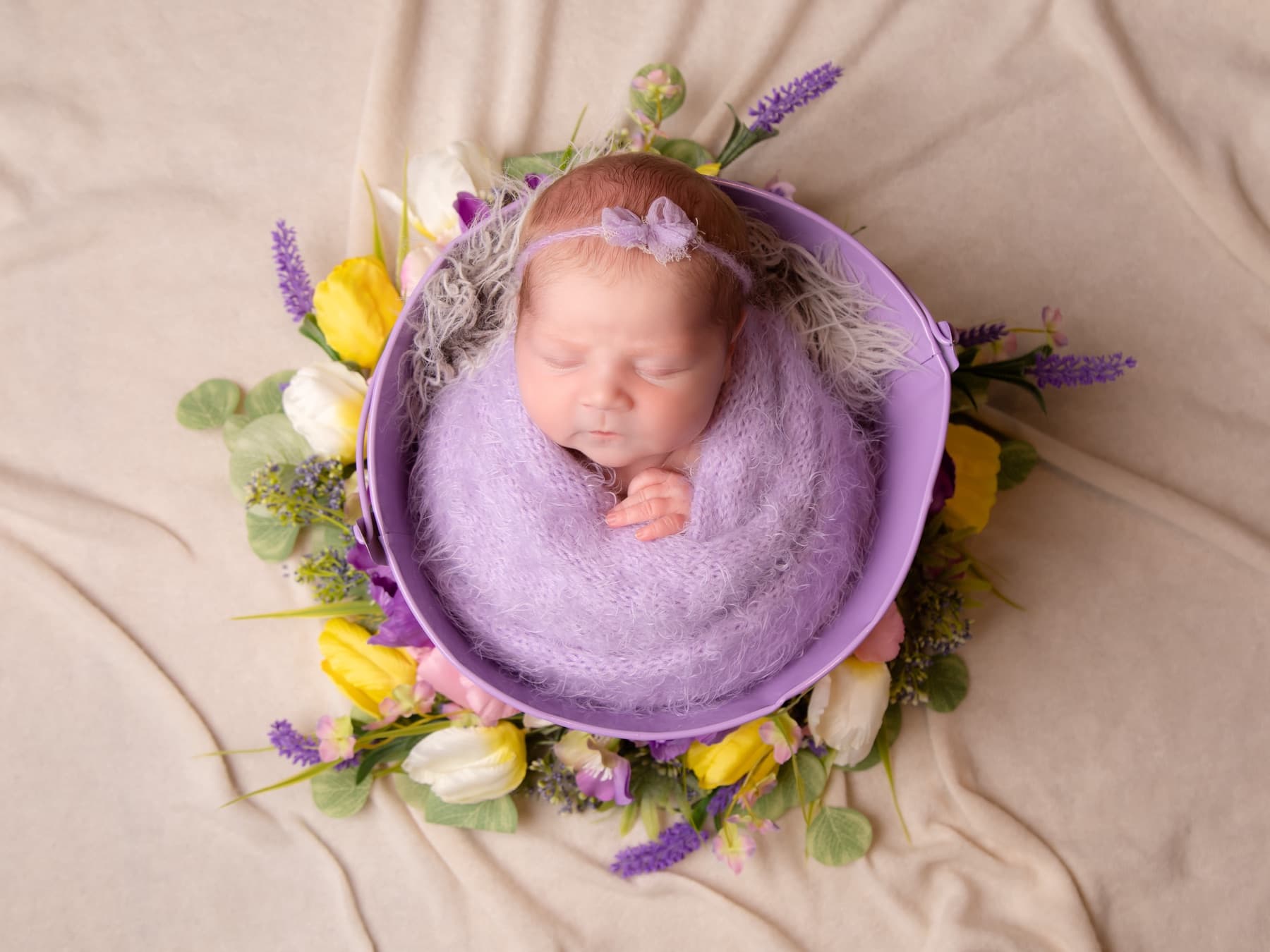 Close newborn portrait with soft, gentle styling