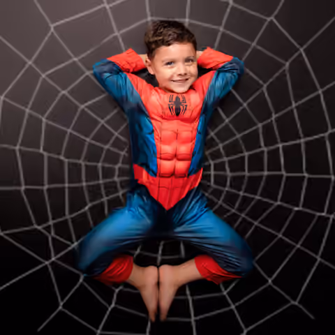 Spider-themed superhero portrait on a graphic black backdrop.